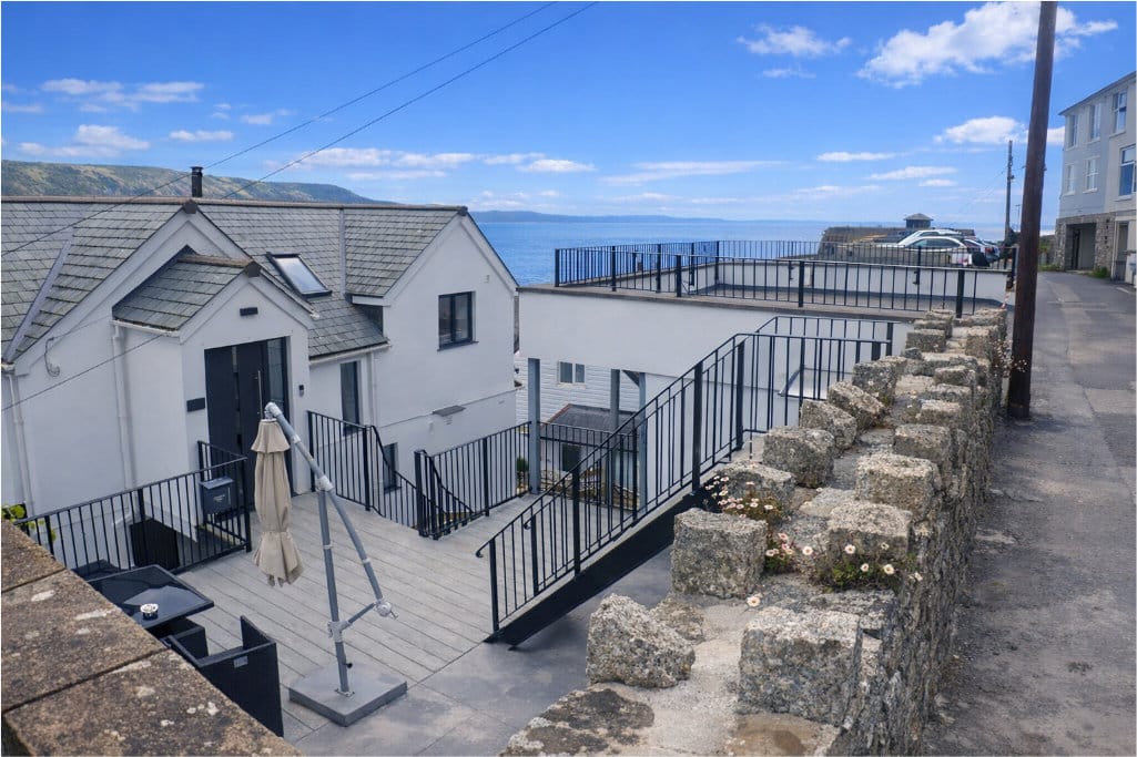 Rear of house and parking overlooking the sea